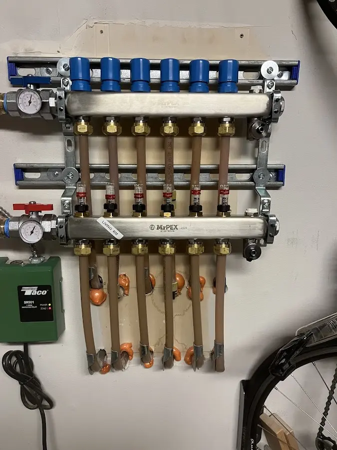 Plumber performing Water Heater Repair at a residential property in Swartz Creek